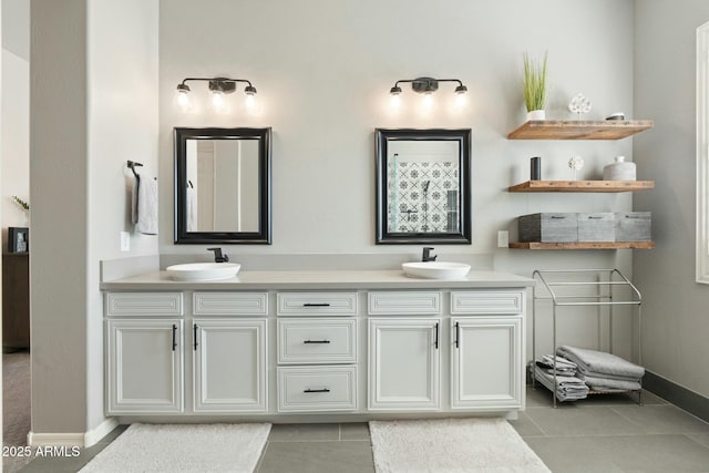 full bathroom with tile patterned flooring, double vanity, and a sink