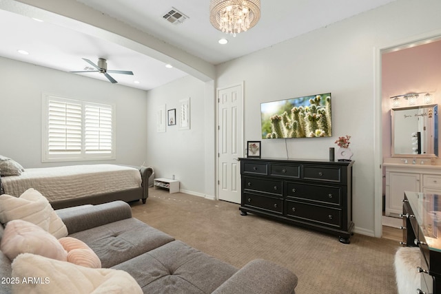 bedroom with visible vents, arched walkways, light colored carpet, and baseboards