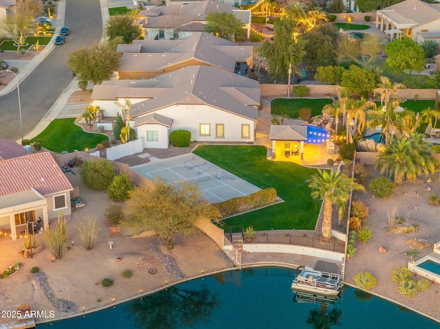 bird's eye view featuring a residential view and a water view