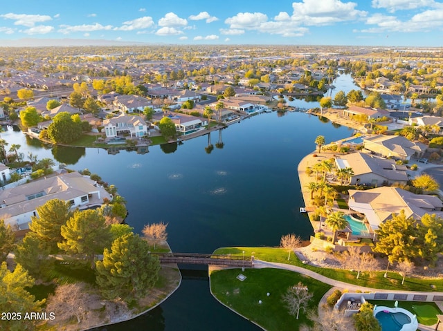 drone / aerial view with a residential view and a water view