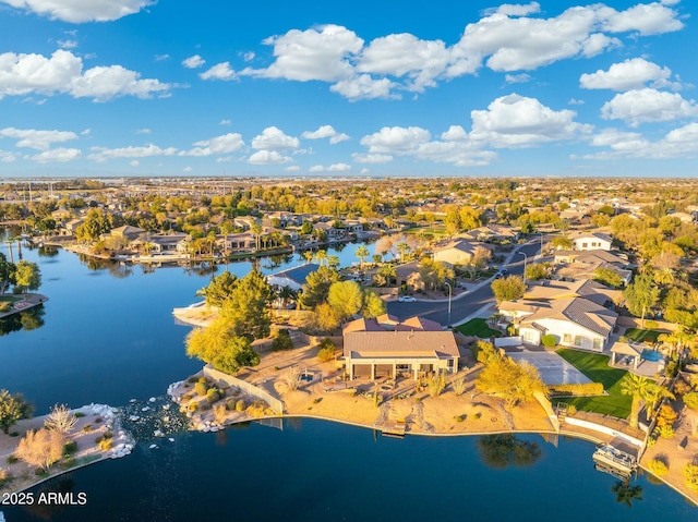 drone / aerial view with a residential view and a water view