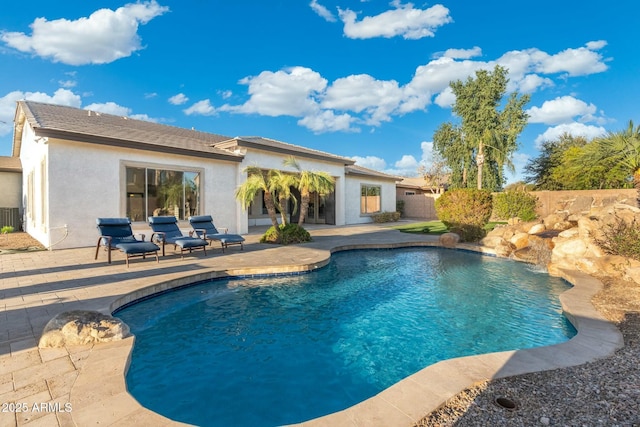 view of swimming pool with fence, a patio area, and a fenced in pool