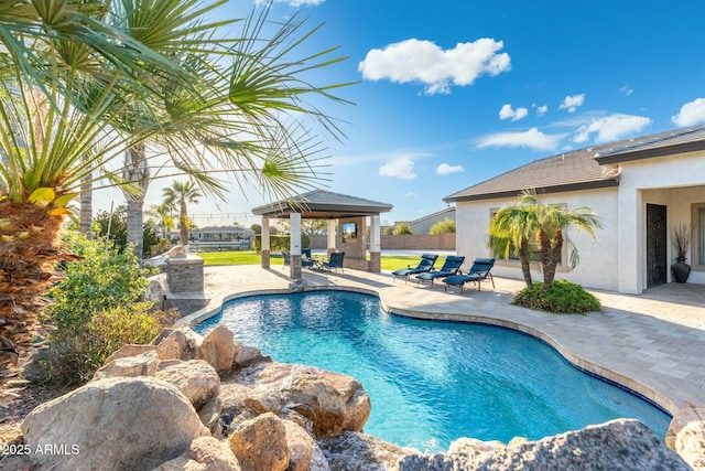 outdoor pool featuring a gazebo and a patio area