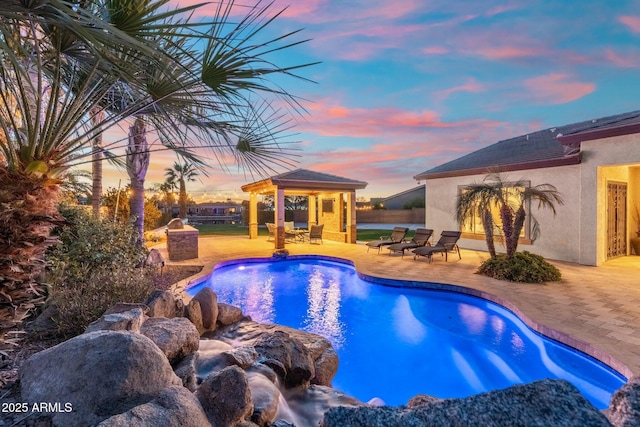 outdoor pool featuring a gazebo and a patio