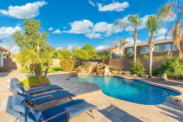view of pool with a fenced in pool, a patio, and a fenced backyard
