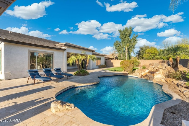 view of swimming pool featuring a fenced in pool, a patio, and fence