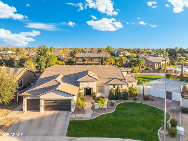 birds eye view of property with a residential view