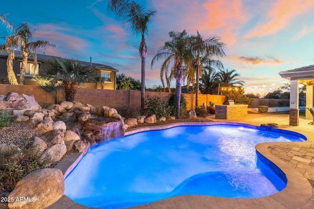 view of swimming pool with a fenced in pool, a patio, and a fenced backyard