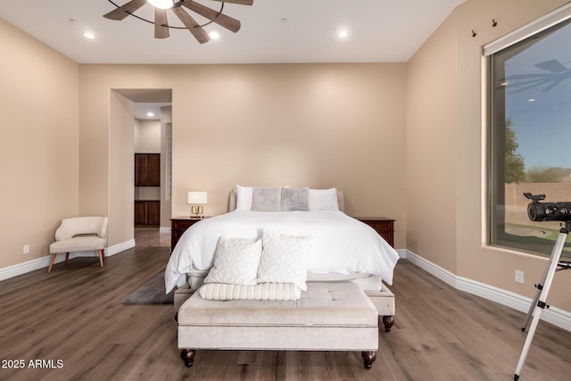 bedroom with hardwood / wood-style flooring and ensuite bathroom