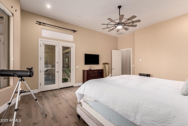 bedroom with french doors, ceiling fan, access to exterior, and hardwood / wood-style floors