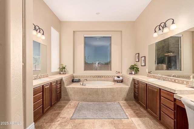 bathroom with vanity and a relaxing tiled tub