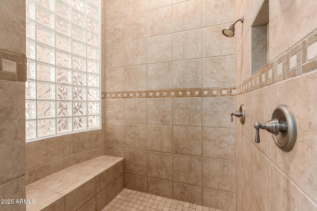 bathroom with tiled shower