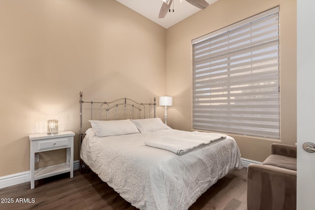 bedroom featuring dark wood-type flooring and ceiling fan