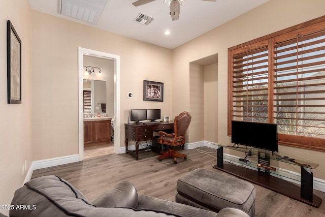 office space featuring ceiling fan and light wood-type flooring