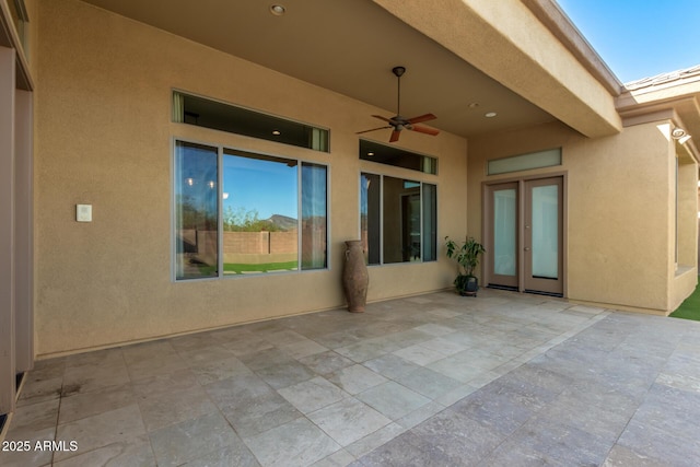 view of patio featuring ceiling fan