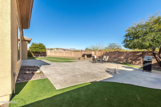 view of patio with a grill