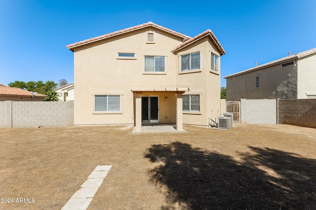 back of house with a patio