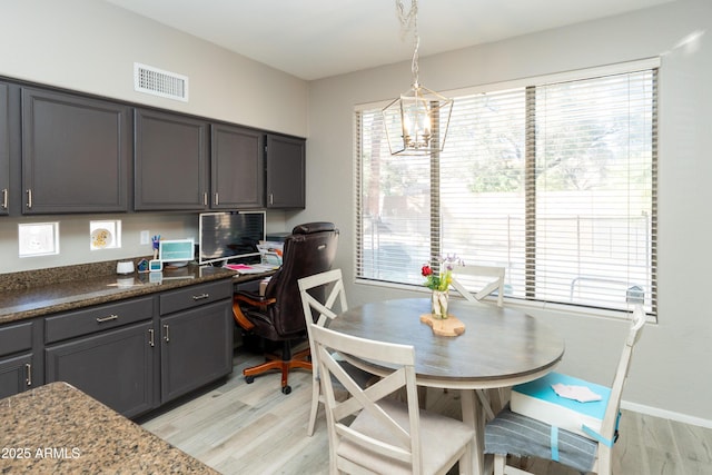 2224 W Olive Way, Chandler, AZ 85248 - dining space with light wood-style floors, healthy amount of natural light, and a chandelier