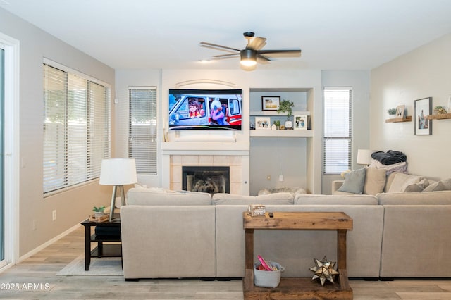 2224 W Olive Way, Chandler, AZ 85248 - living room featuring wood finished floors, ceiling fan, and a fireplace