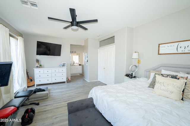 2224 W Olive Way, Chandler, AZ 85248 - bedroom featuring wood finished floors, a closet, ensuite bathroom, ceiling fan, and baseboards