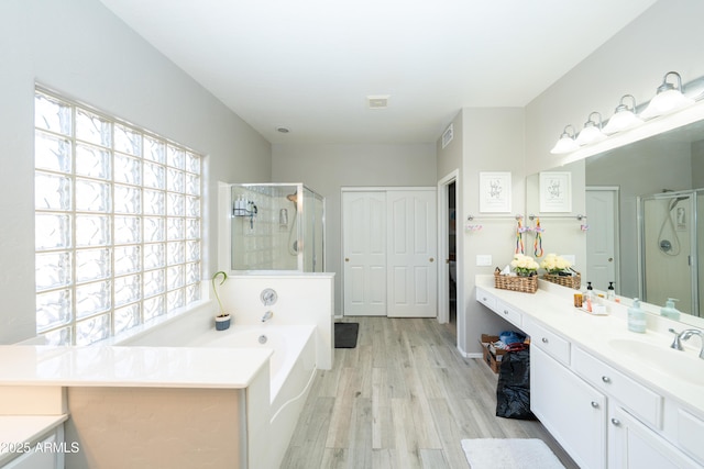 2224 W Olive Way, Chandler, AZ 85248 - bathroom featuring a stall shower, healthy amount of natural light, and wood finished floors