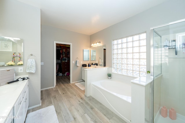 2224 W Olive Way, Chandler, AZ 85248 - full bathroom with a stall shower, wood finished floors, vanity, a bath, and baseboards