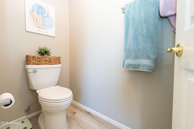 2224 W Olive Way, Chandler, AZ 85248 - half bathroom featuring baseboards, toilet, and wood finished floors