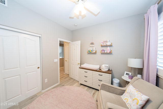 2224 W Olive Way, Chandler, AZ 85248 - bedroom featuring light wood finished floors, a ceiling fan, baseboards, and a closet