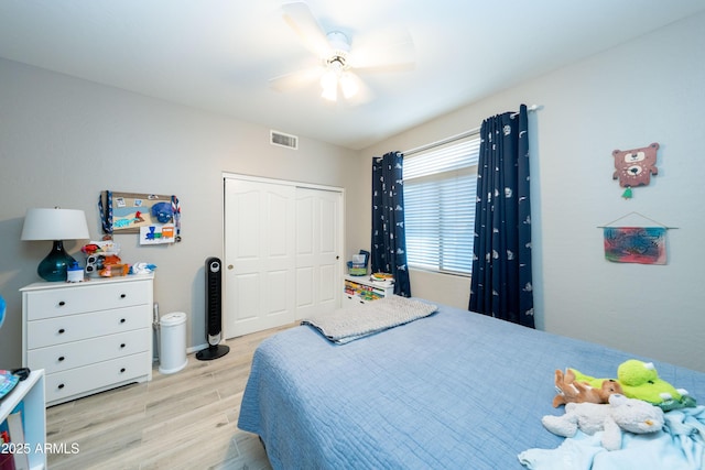 2224 W Olive Way, Chandler, AZ 85248 - bedroom with wood finished floors, a closet, and ceiling fan