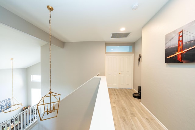 2224 W Olive Way, Chandler, AZ 85248 - hall featuring light wood finished floors, an upstairs landing, baseboards, and a chandelier
