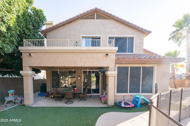 2224 W Olive Way, Chandler, AZ 85248 - back of house with a balcony, stucco siding, a patio area, and a tiled roof