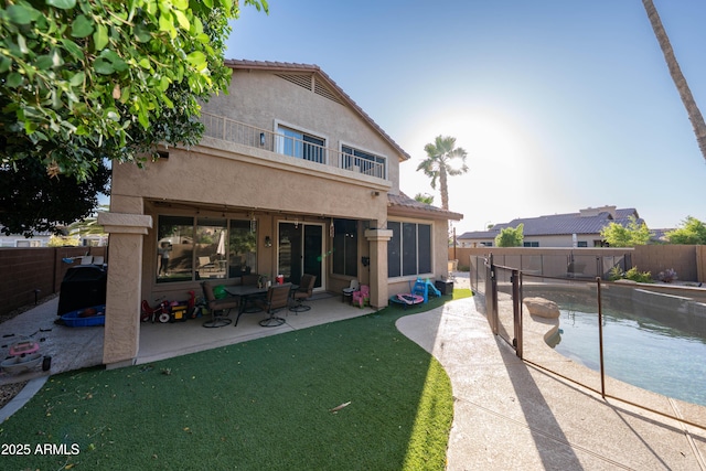 2224 W Olive Way, Chandler, AZ 85248 - back of property featuring a balcony, stucco siding, and a patio