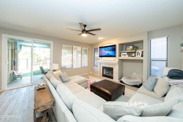 2224 W Olive Way, Chandler, AZ 85248 - living room with a ceiling fan, a fireplace, and wood finished floors