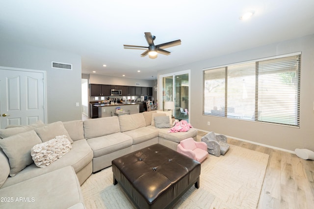 2224 W Olive Way, Chandler, AZ 85248 - living area with light wood finished floors, a ceiling fan, baseboards, and recessed lighting