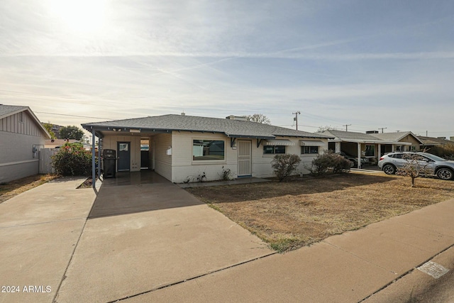 view of front of home with a carport