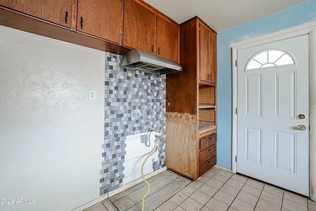 kitchen featuring light tile patterned flooring