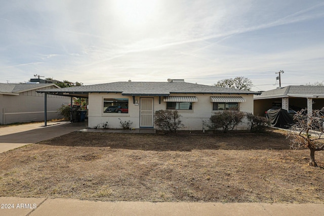 ranch-style house with a carport