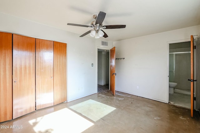 unfurnished bedroom featuring ceiling fan, concrete flooring, connected bathroom, and a closet