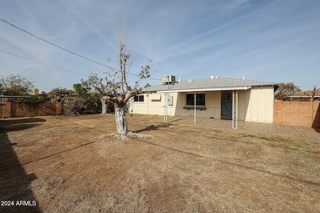 back of property featuring central air condition unit