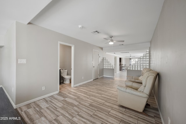 405 W Monte Way, Phoenix, AZ 85041 - sitting room featuring a ceiling fan and baseboards