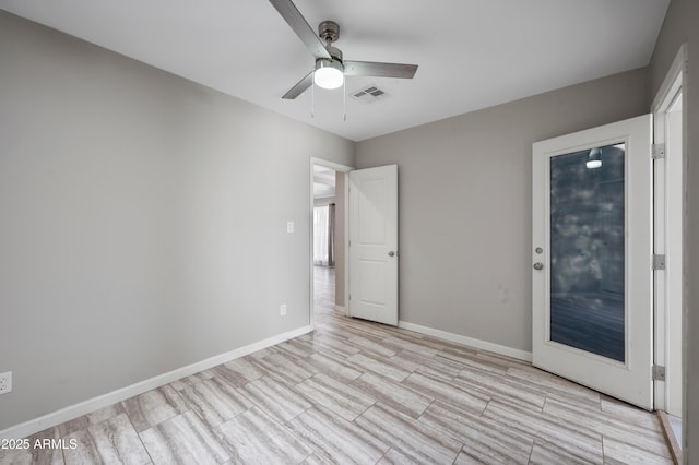 405 W Monte Way, Phoenix, AZ 85041 - unfurnished bedroom featuring baseboards, ceiling fan, and light wood finished floors