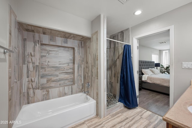 405 W Monte Way, Phoenix, AZ 85041 - bathroom with ensuite bathroom, wood finished floors, vanity, and recessed lighting