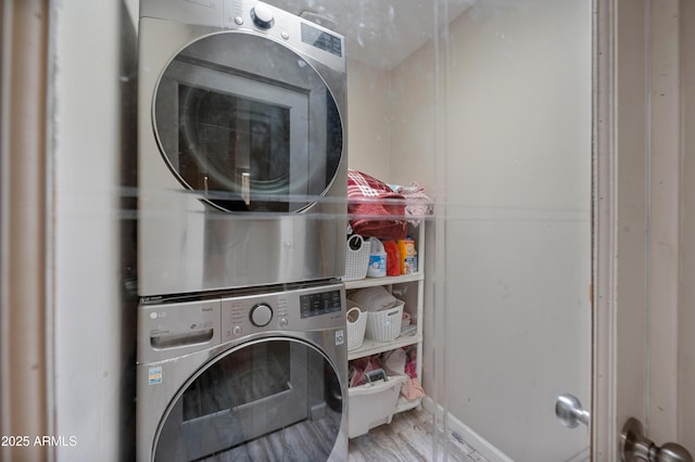 405 W Monte Way, Phoenix, AZ 85041 - washroom with stacked washer / dryer and wood finished floors