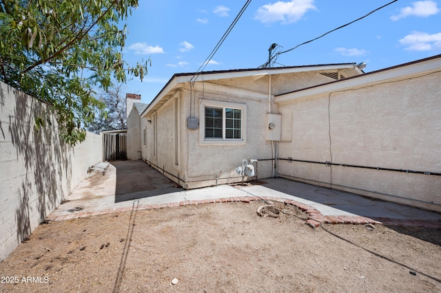 405 W Monte Way, Phoenix, AZ 85041 - rear view of house featuring a fenced backyard, a patio, and stucco siding