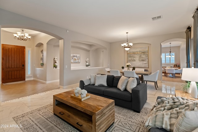 living room with a notable chandelier