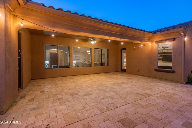 view of patio terrace at dusk