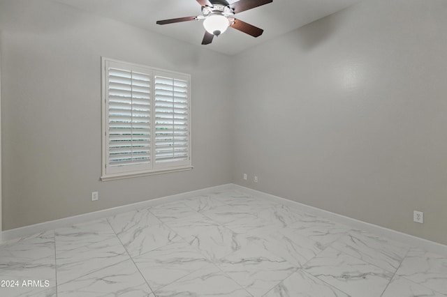 spare room with ceiling fan