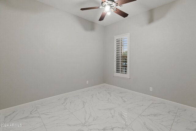 spare room with ceiling fan