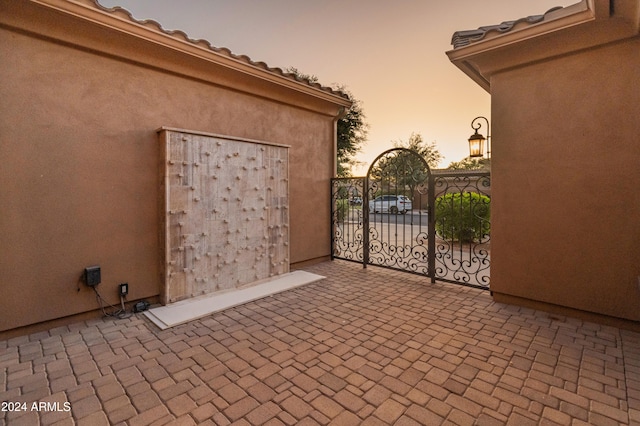 view of patio terrace at dusk