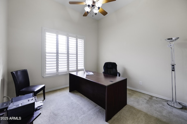 office with light colored carpet, ceiling fan, baseboards, and lofted ceiling